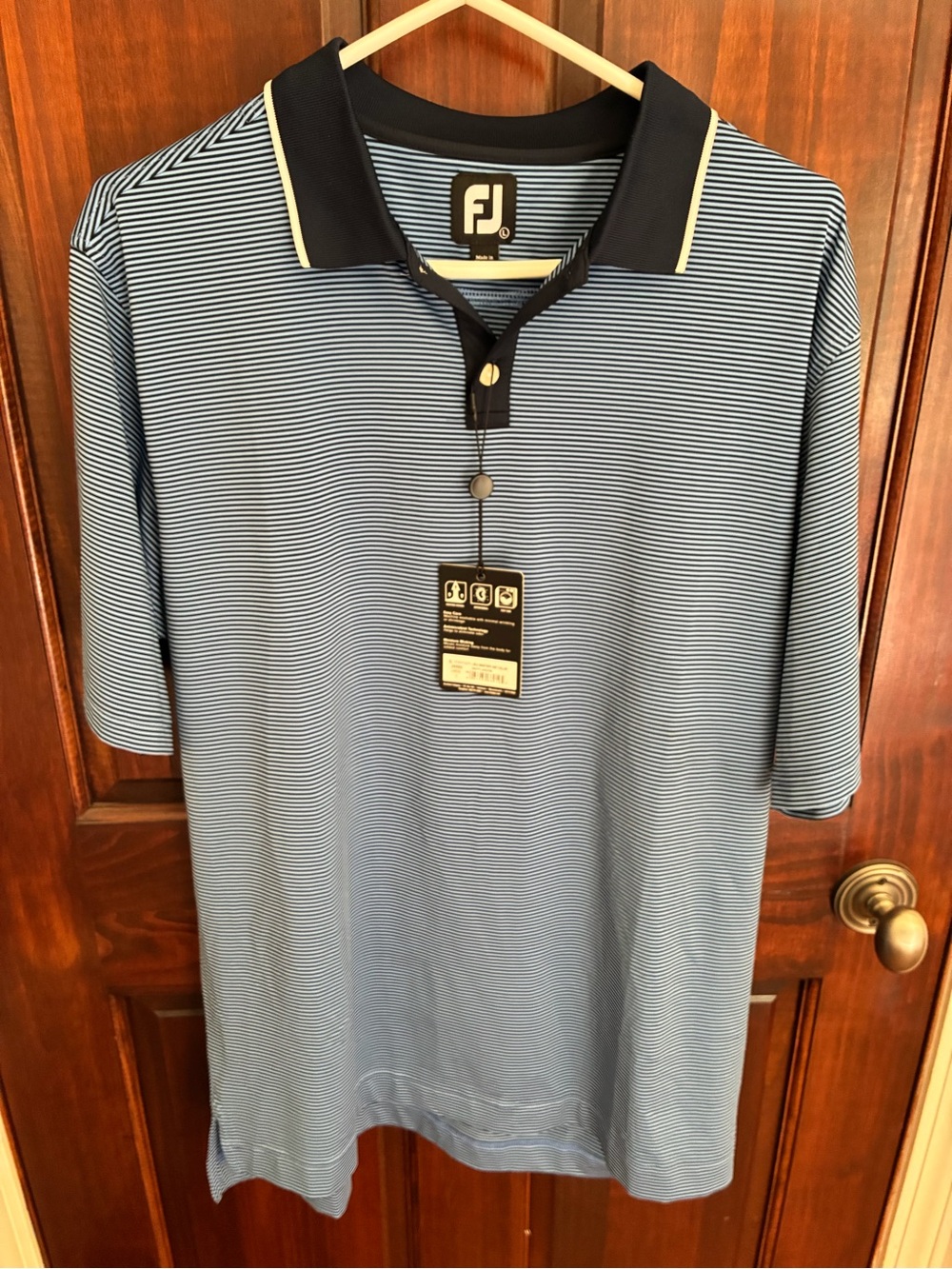 FootJoy Men's Light Blue and Striped Polo with Navy collar. Moisture wicking.
